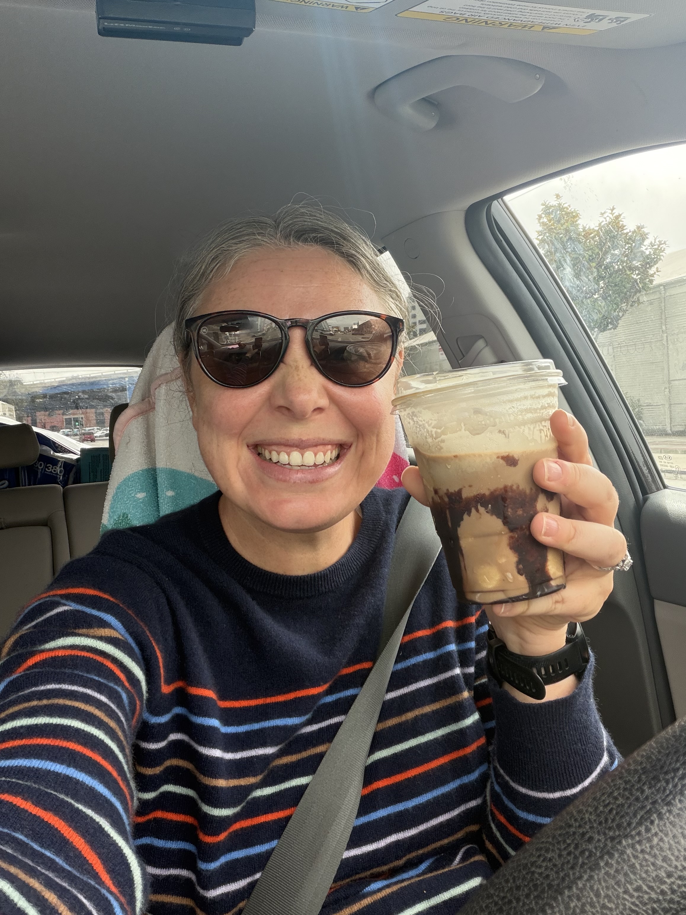 Selfie in the car holding a Costco food-court frozen mocha